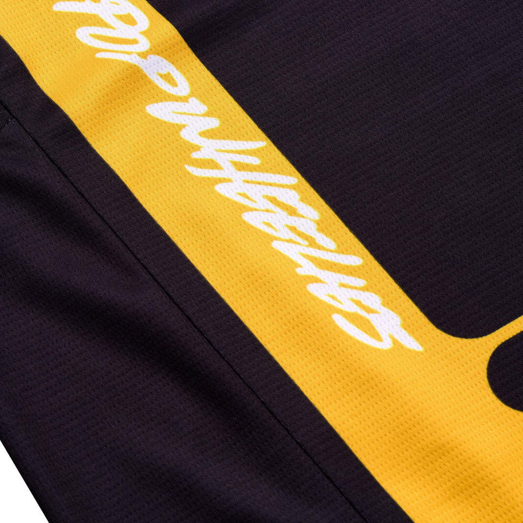 Troy Lee Designs GP Pro Fifty-50 Jersey Black/Gold - Close-Up of Right Sleeve Pop Wheelies Graphic