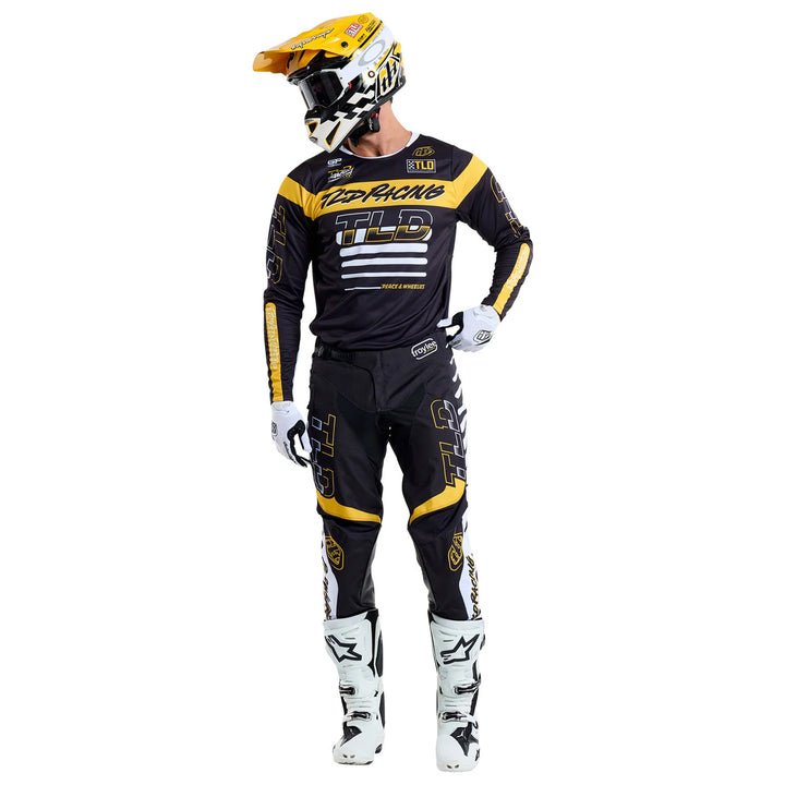 Troy Lee Designs GP Pro Fifty-50 Jersey Black/Gold - Full Front View of Model Wearing Jersey
