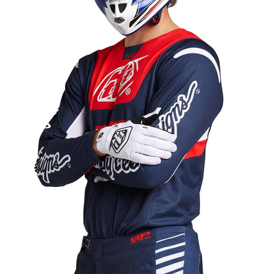 Troy Lee Designs GP Pro Blends Jersey Navy/Orange - Front Side View of Model Posing in Jersey with Arms Crossed