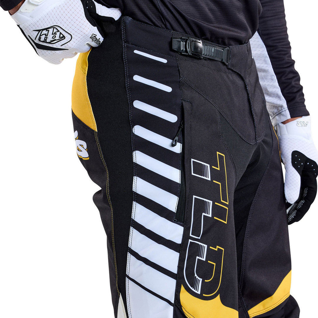 Troy Lee Designs GP Pro Fifty-50 Pants Black/Gold - Close-Up Side View of Model Wearing Pants
