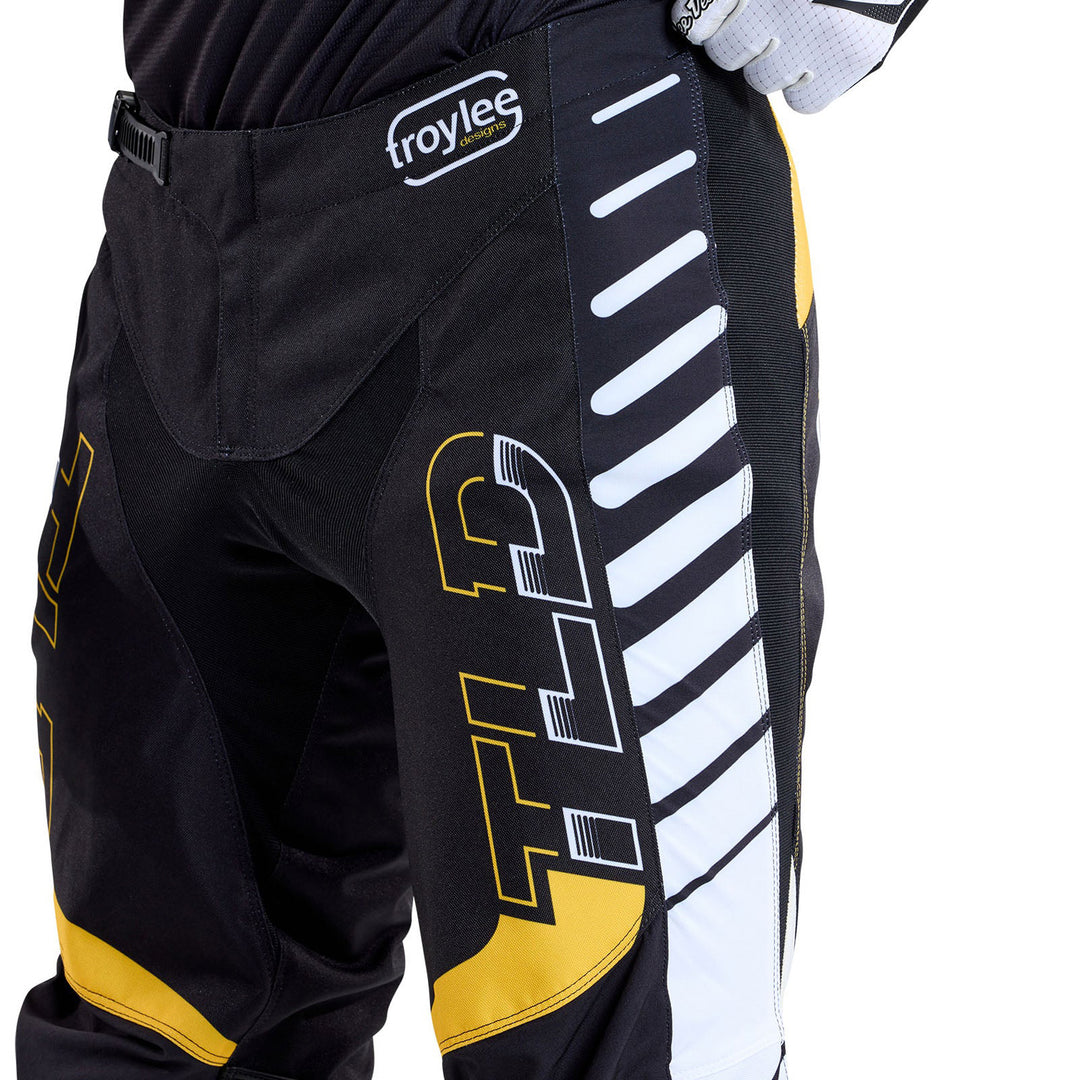 Troy Lee Designs GP Pro Fifty-50 Pants Black/Gold - Close-Up Front Side View of Model Wearing Pants