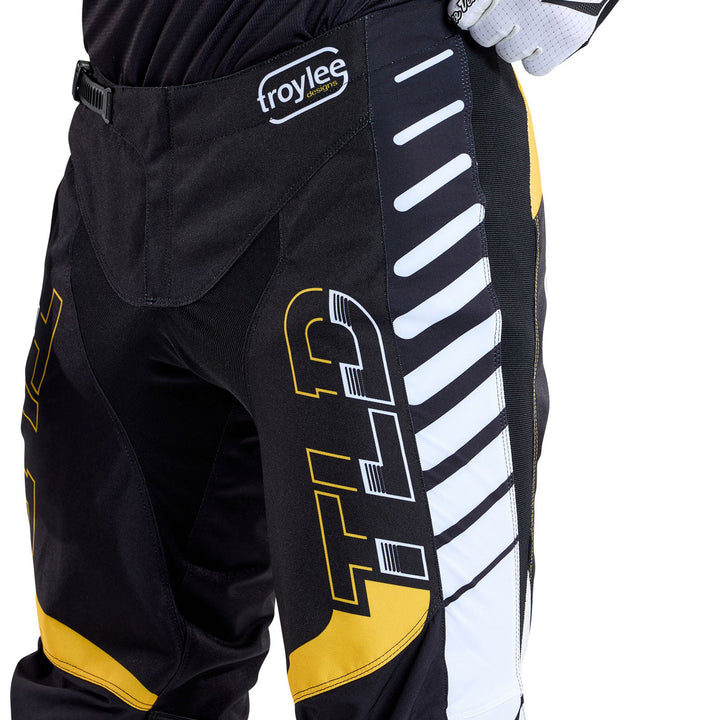 Troy Lee Designs GP Pro Fifty-50 Pants Black/Gold - Close-Up Front Side View of Model Wearing Pants