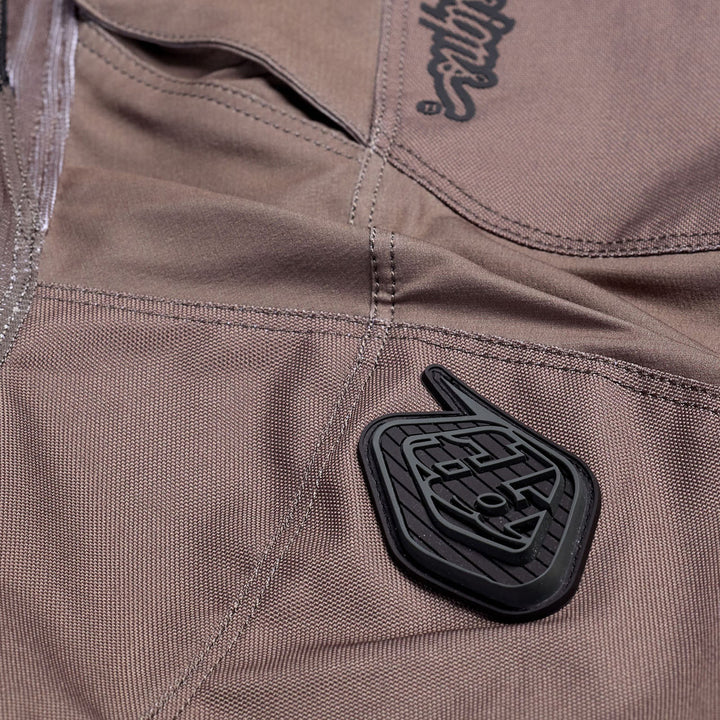 Troy Lee Designs Scout GP Solid Pants Tarmac - Close-Up of Rubber Brand Logo Above Knee