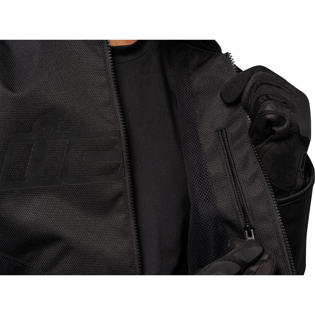 ICON Hooligan™ CE Jacket Black - Close-Up of Model Unzipping Inner Pocket
