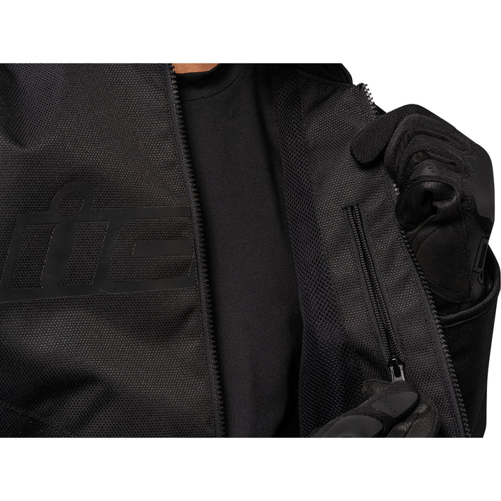 ICON Hooligan™ CE Jacket Black - Close-Up of Model Unzipping Inner Pocket