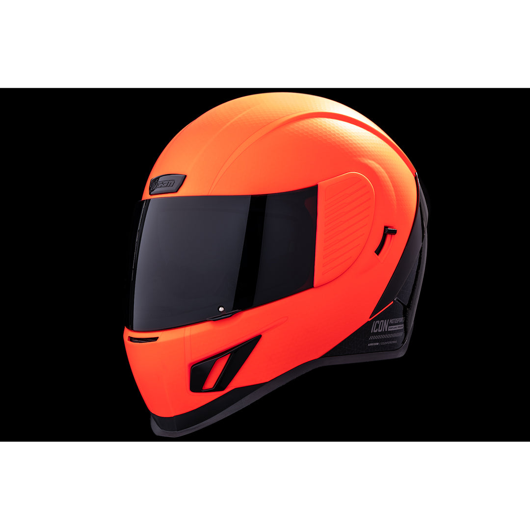 ICON Airform™ Counterstrike MIPS® Helmet Red - Front Left Side View with Dark Studio Background