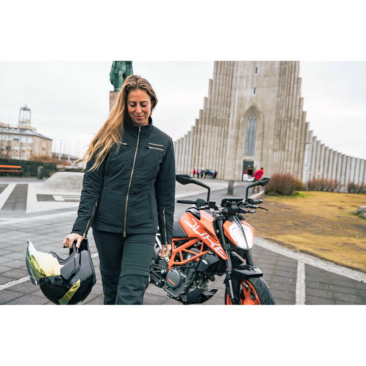 ICON Airflite™ Helmet Rear Spoiler RST Gold - Lifestyle Shot of Rider in City Carrying Helmet with Spoiler Installed