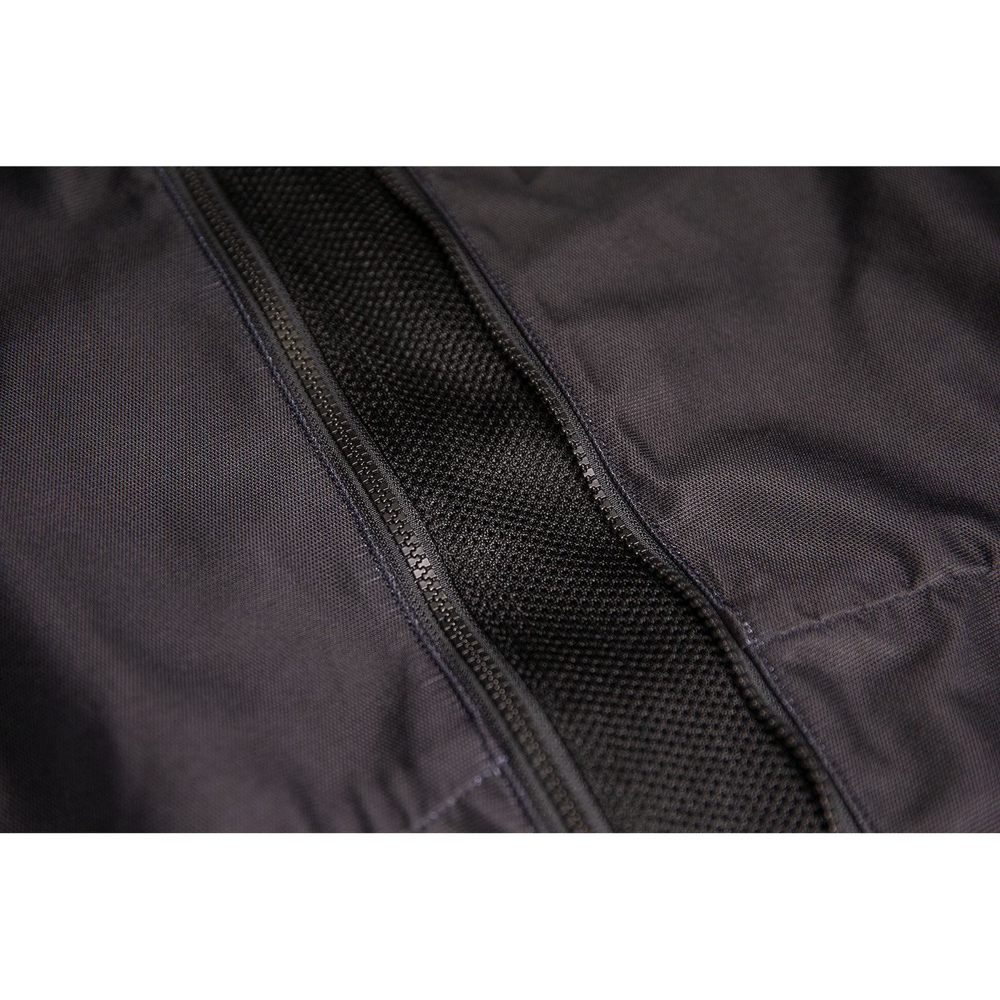 ICON Airform Jacket Black - Close-Up of Expanded Mesh in Unzipped Front Zipper at Midsection