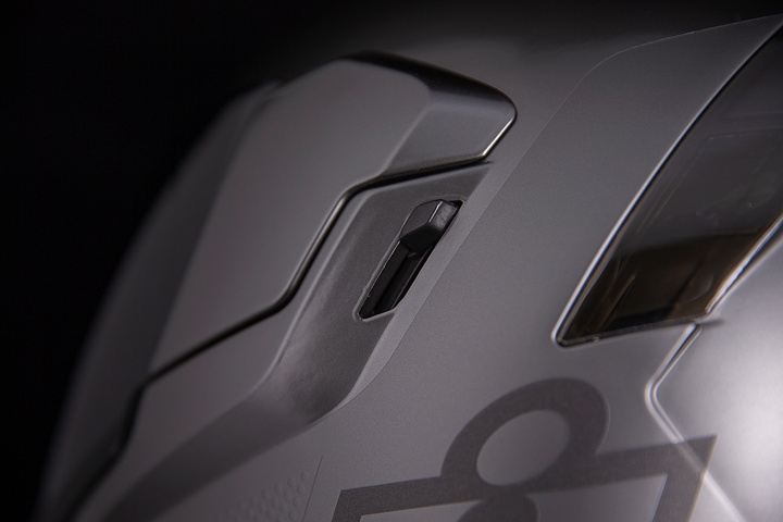 ICON Airflite Jewel MIPS Full Face Motorcycle Helmet Silver - Close-Up of Drop Down Sun Visor Switch