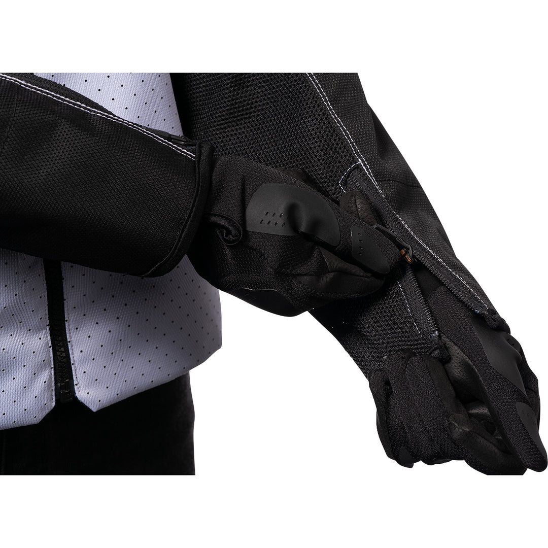 ICON Hooligan™ CE Jacket White - Close-Up of Model Zipping Wrist Zipper