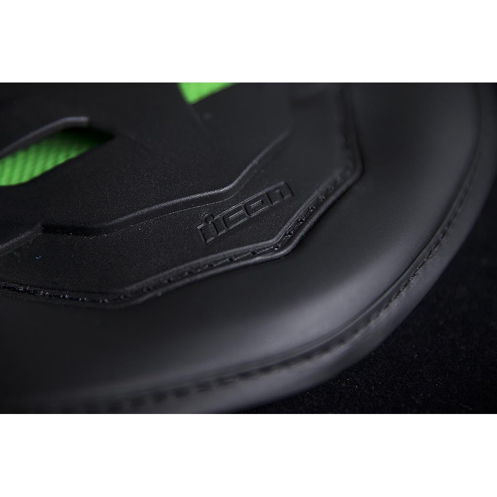 ICON Stryker Vest Green - Close-Up of Logo on Lower Tip of Spine Plate
