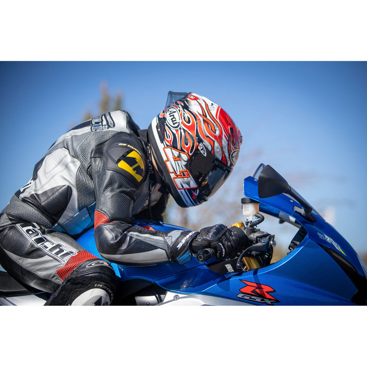 Arai Corsair-X Haga GP Helmet - LIfestyle Shot of racer on blue motorcycle