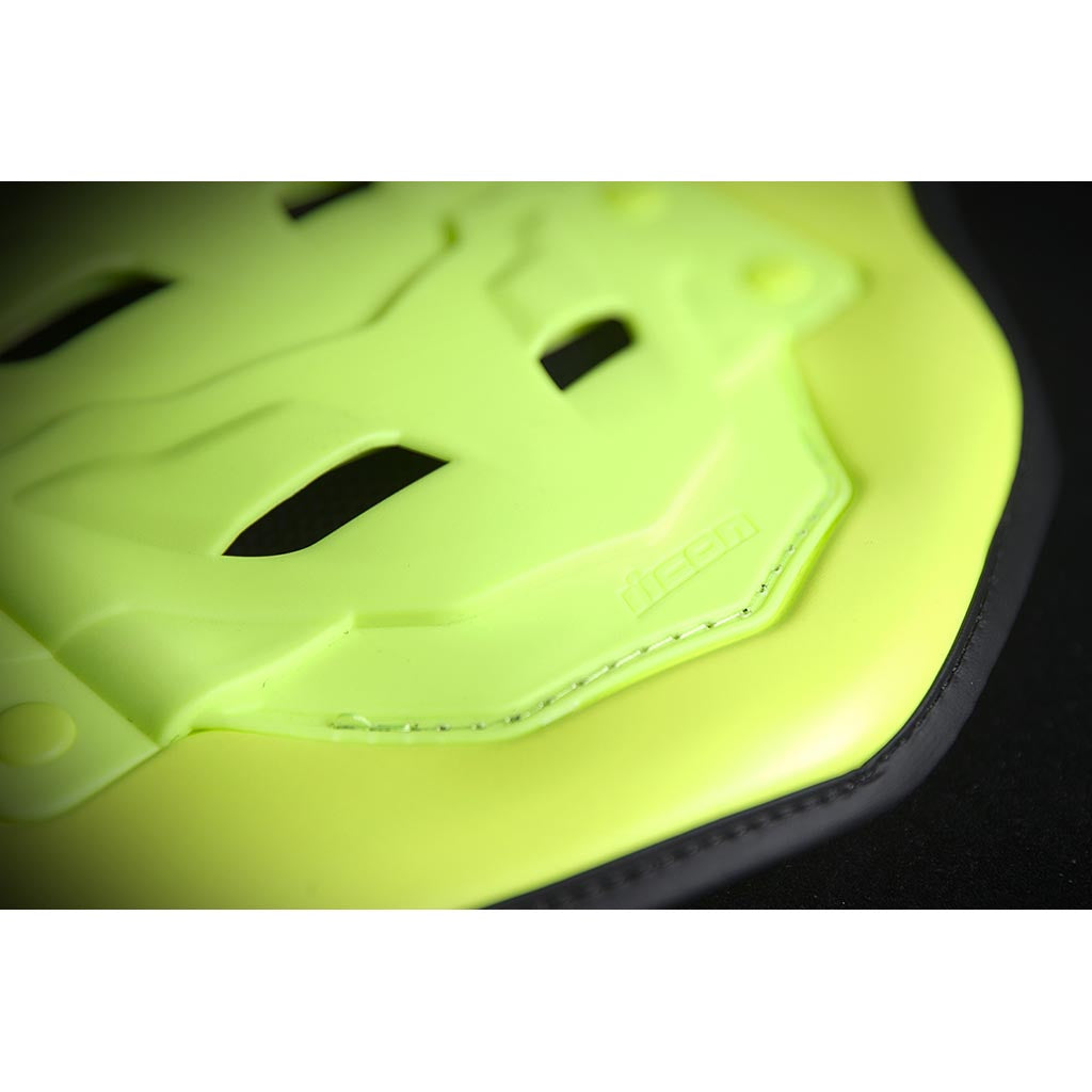 ICON Stryker Vest Yel - Close-Up of Logo on Lower Tip of Spine Plate