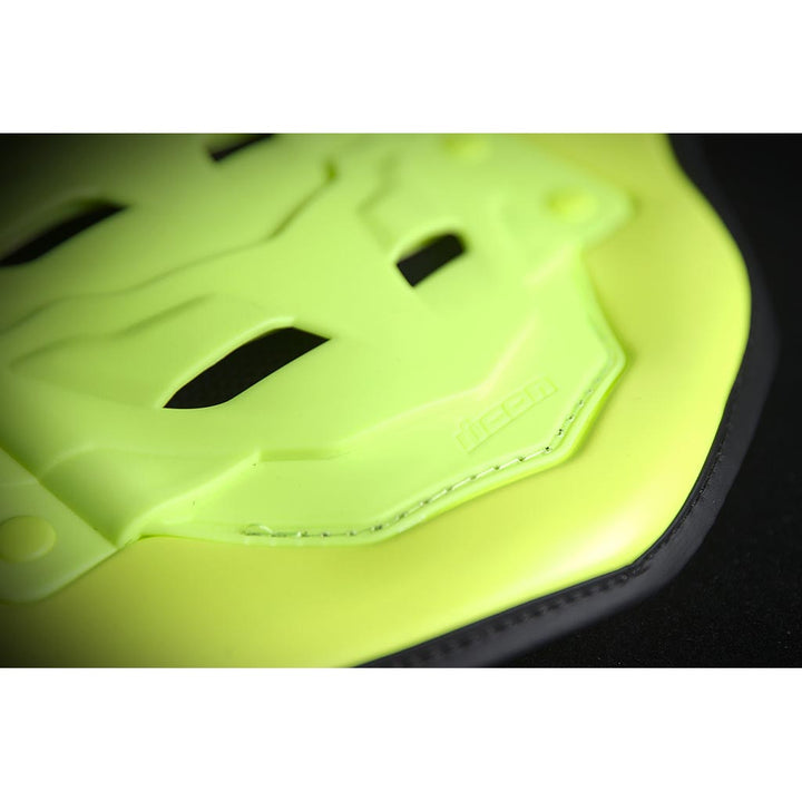 ICON Stryker Vest Yel - Close-Up of Logo on Lower Tip of Spine Plate