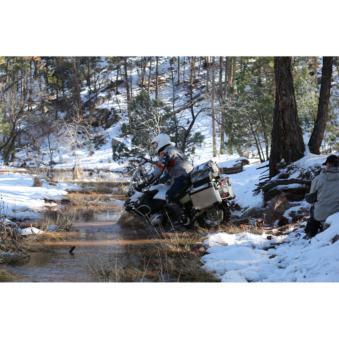 Arai XD-4 Solid Helmet White - Lifestyle Wide Shot of Rider in helmet taking Motorcycle through shallow stream