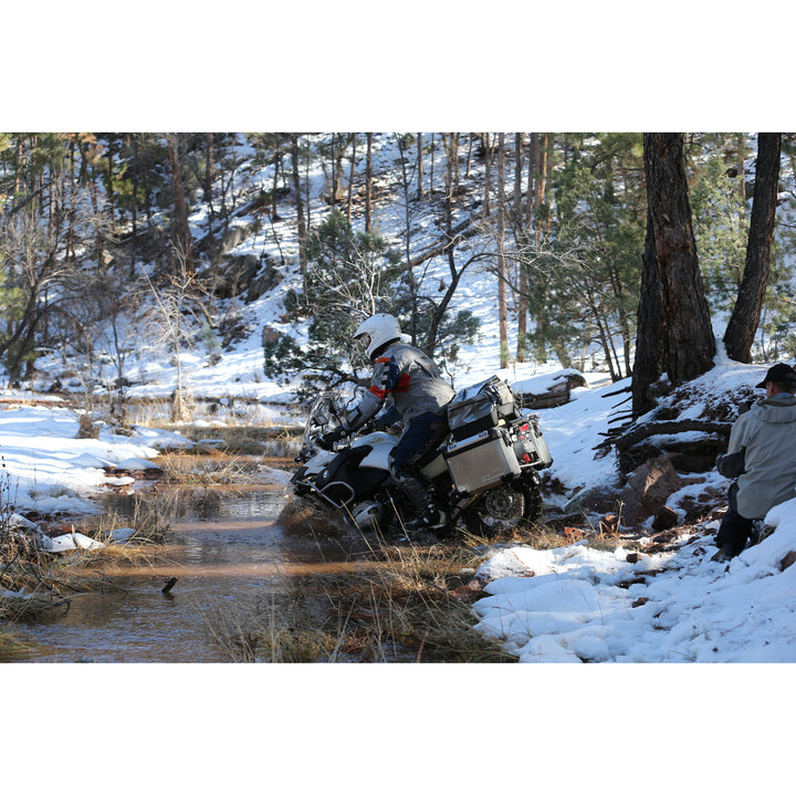 Arai XD-4 Solid Helmet White - Lifestyle Wide Shot of Rider in helmet taking Motorcycle through shallow stream