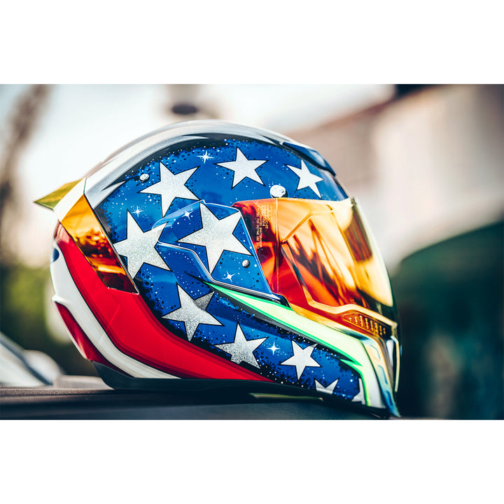 ICON Airflite™ Space Force Helmet Glory - Lifestyle Shot of Helmet Resting on Table