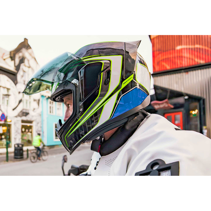 ICON Airflite™ Helmet Rear Spoiler Smoke - Lifestyle Shot of Rider in City Wearing Helmet with Spoiler Installed