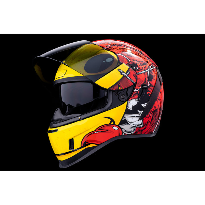 ICON Airform™ Brozak MIPS® Helmet Red - Front Left Side View with Dark Studio Background, Faceshield Raised, and Drop Down Sun Visor Lowered