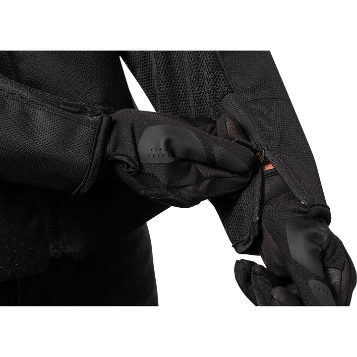 ICON Hooligan™ CE Jacket Black - Close-Up of Model Zipping Wrist Zipper