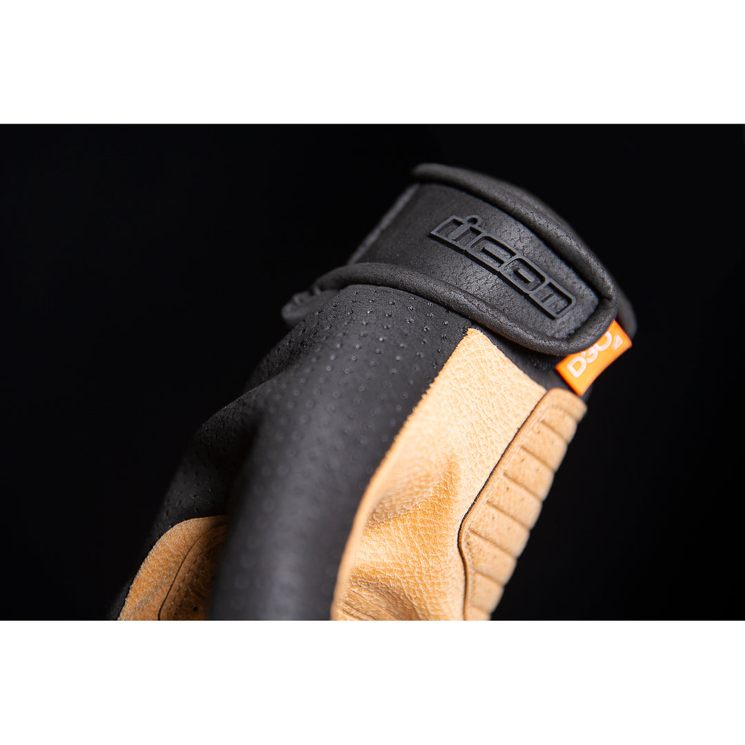 ICON Airform™ Gloves Black/Tan - Close-Up of Logo on Wrist Strap