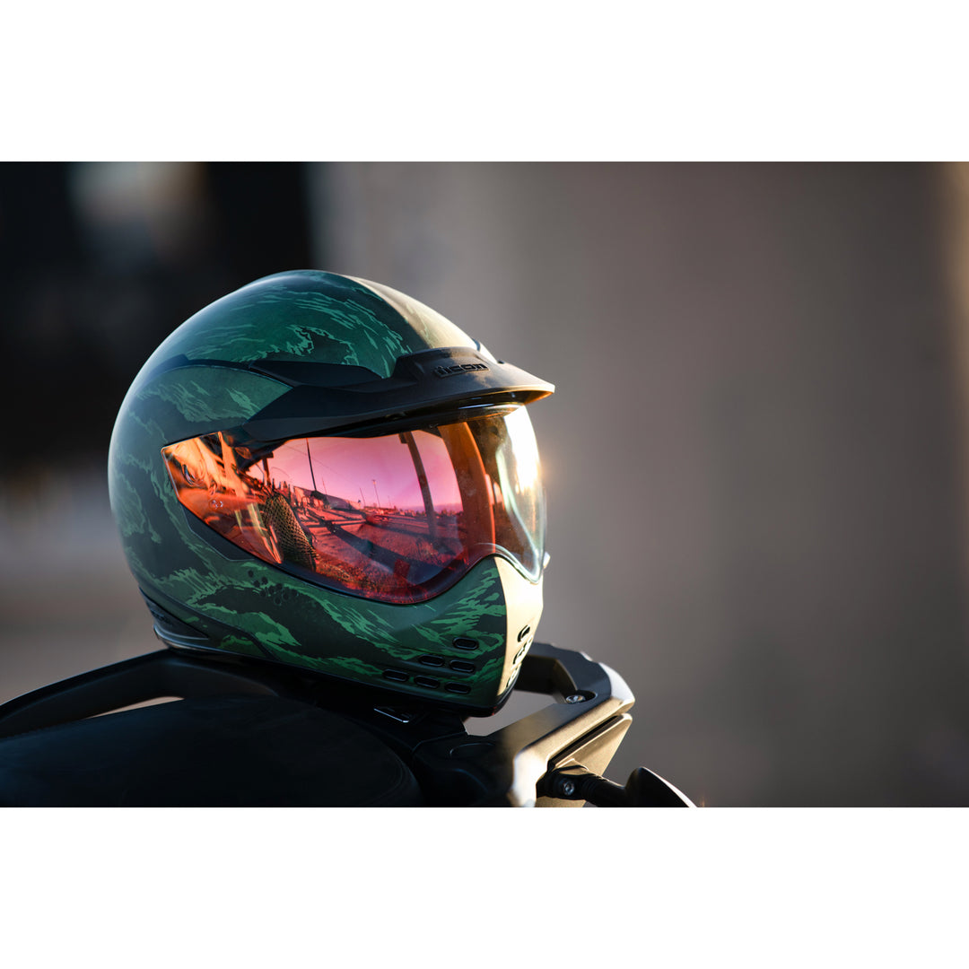 ICON Domain™ Tiger's Blood Helmet Green - Lifestyle of Helmet Set on Tail of Dual Sport Motorcycle
