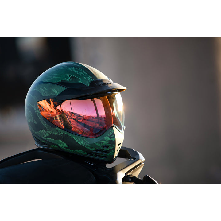 ICON Domain™ Tiger's Blood Helmet Green - Lifestyle of Helmet Set on Tail of Dual Sport Motorcycle