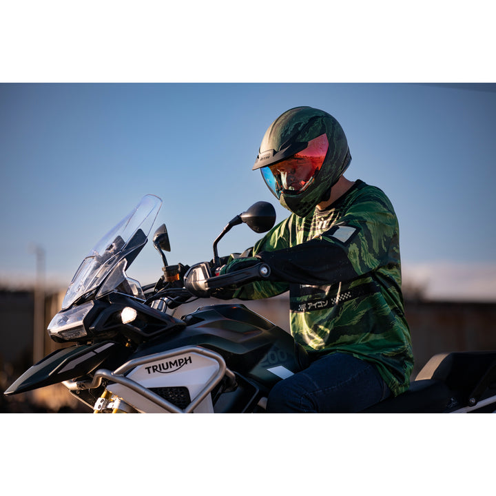 ICON Domain™ Tiger's Blood Helmet Green - Lifestyle of Rider Wearing Helmet on Dual Sport Motorcycle