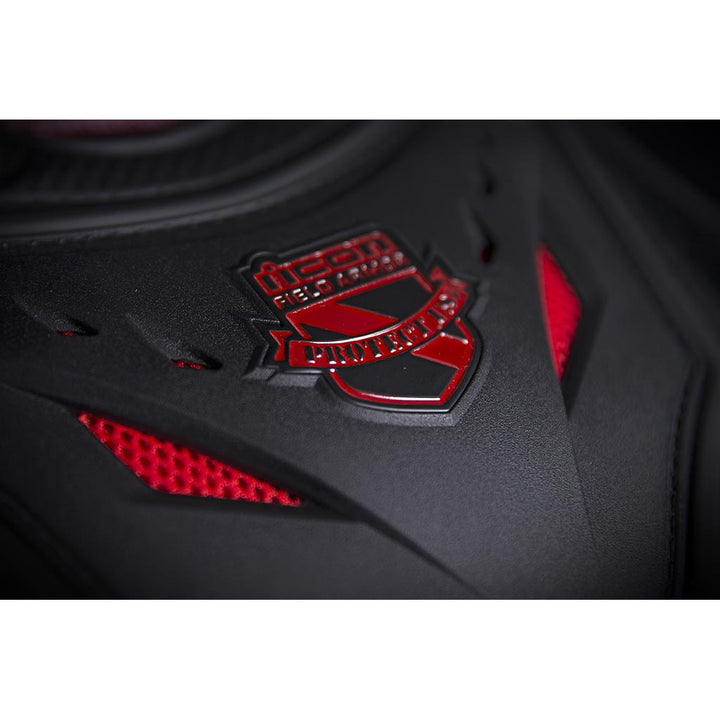 ICON Stryker Vest Red - Close-Up of Logo on Chest Plate