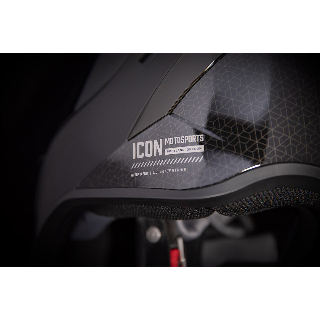 ICON Airform™ Counterstrike MIPS® Helmet Black - Close-Up of Logo and Model Details on Left Side
