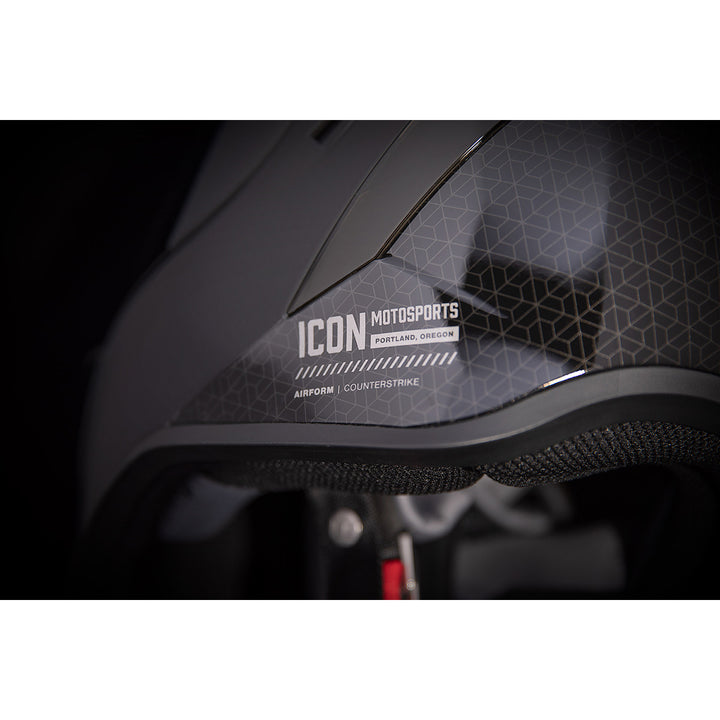 ICON Airform™ Counterstrike MIPS® Helmet Black - Close-Up of Logo and Model Details on Left Side