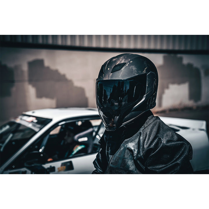 ICON Airflite™ Demo MIPS® Helmet Black - Lifestyle of Rider Wearing Helmet