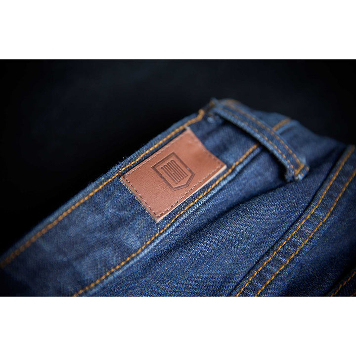 ICON Motorcycle Women's MH1000 Jean Blue - Close-Up of Patch Sewed onto Waist Band