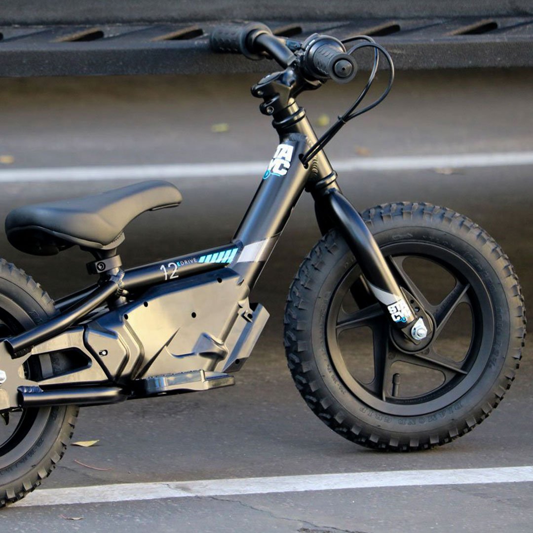 Stacyc Electric Bikes Stacyc 12EDRIVE - Lifestyle of Parked Bicycle in Parking Lot