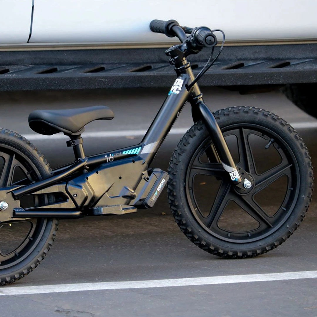 Stacyc Electric Bikes Stacyc 16EDRIVE Brushless - Lifestyle of Bike Parked in Parking Lot
