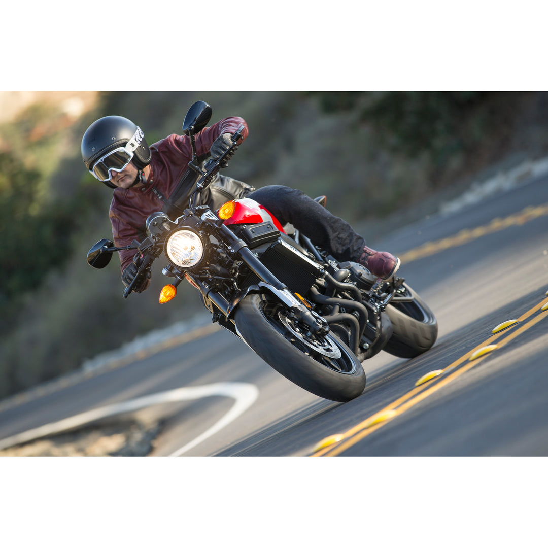 Arai Classic-V Helmet - Lifestyle shot of rider wearing black frost helmet on red motorcycle