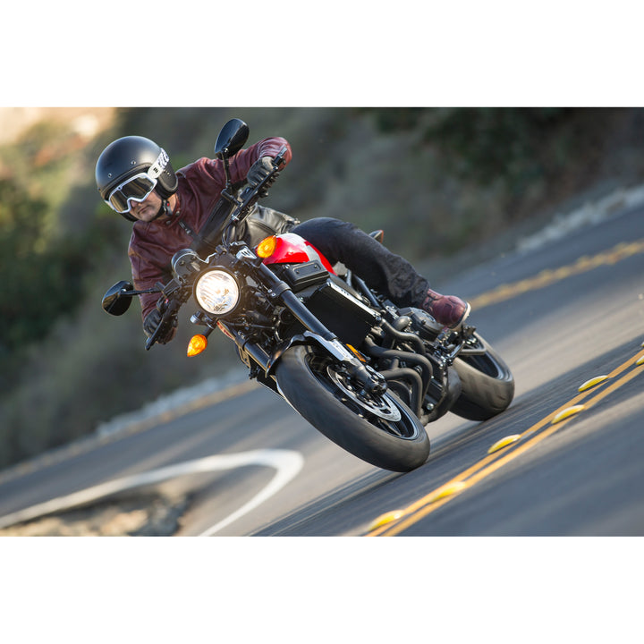 Arai Classic-V Helmet - Lifestyle shot of rider wearing black frost helmet on red motorcycle