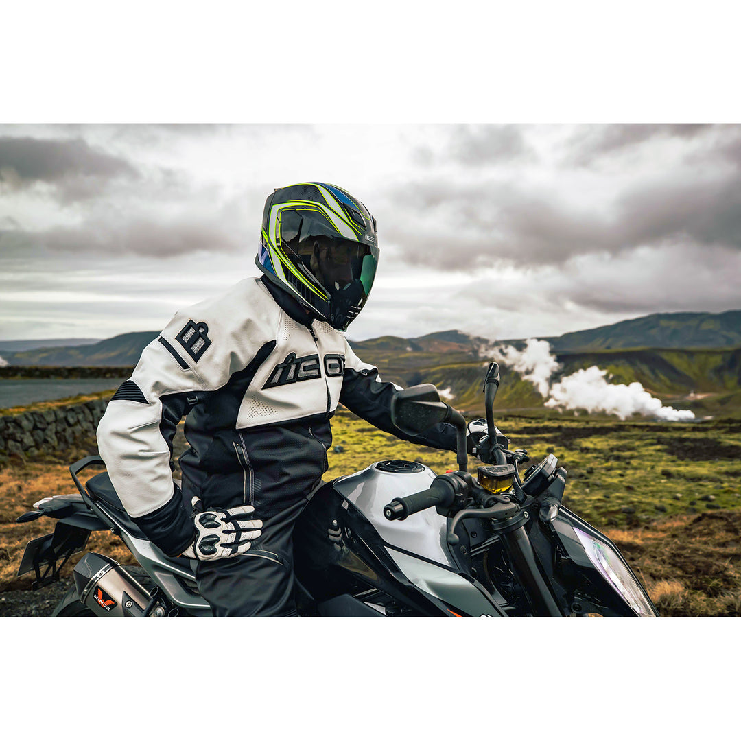 ICON Airflite™ Helmet FliteShield™ RST Lifestyle Shot of Rider in Mountains Wearing Helmet with Dark Smoke Fliteshield