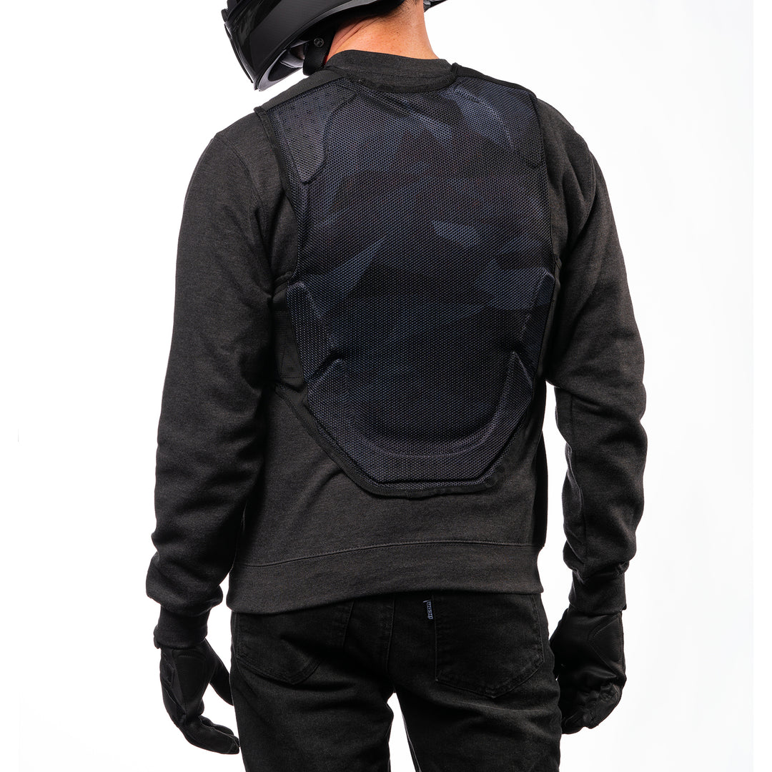 ICON Field Armor Softcore™ Vest Dark Camo - Rear View of Model Posing in Vest