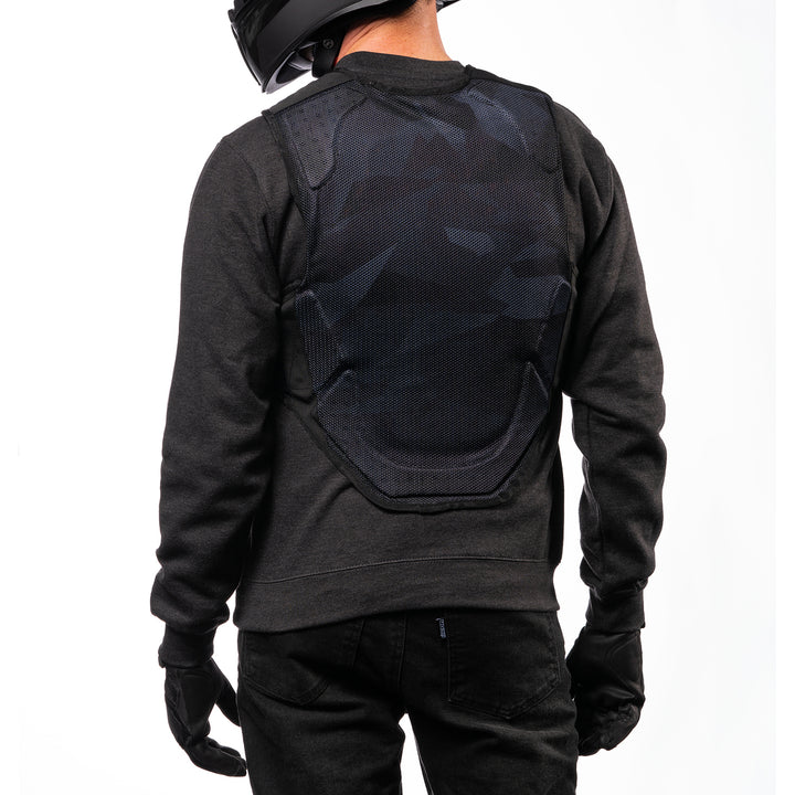 ICON Field Armor Softcore™ Vest Dark Camo - Rear View of Model Posing in Vest