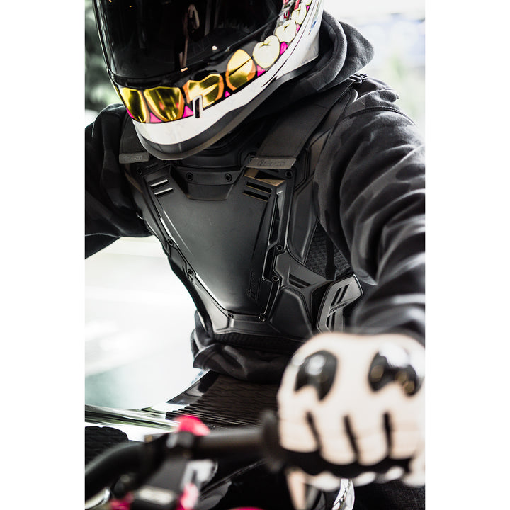 ICON Field Armor 3™ Vest Stealth - Lifestyle Angled Close-Up of Rider Wearing Vest