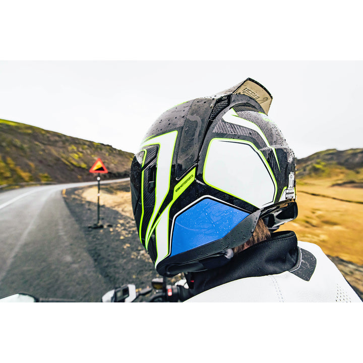ICON Airflite™ Helmet Rear Spoiler Smoke - Lifestyle Shot of Rider in Mountains Wearing Helmet with Spoiler Installed