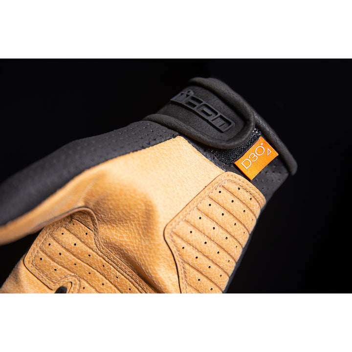 ICON Airform™ Gloves Black/Tan - Close-up of Wrist Strap and D3O Tag